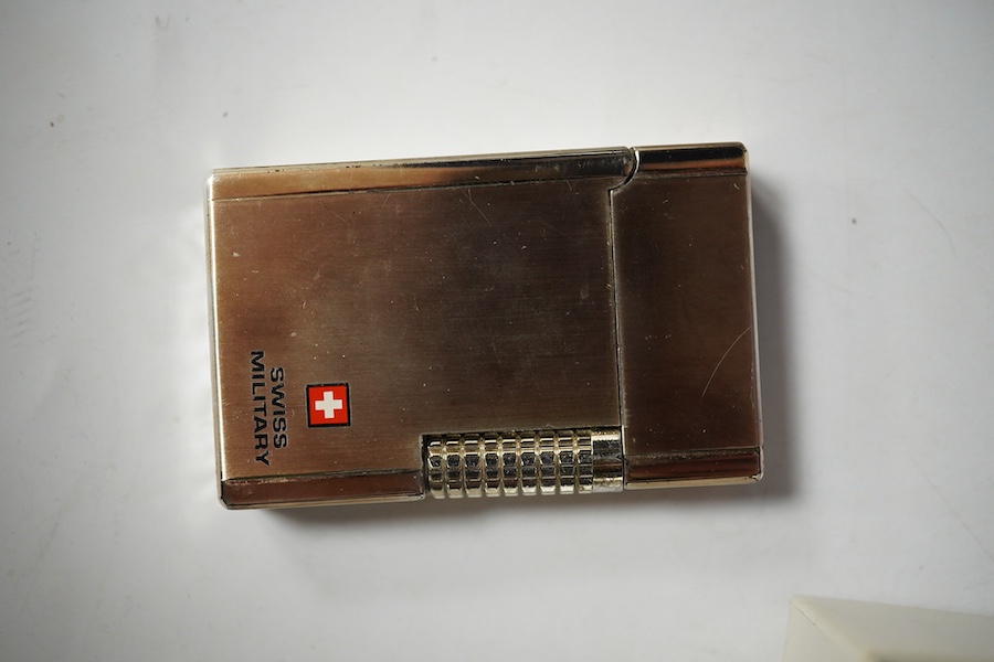 Sundry items comprising, two luxury wallets, boxed, Swiss military lighter and gent's manicure set. Condition - fair